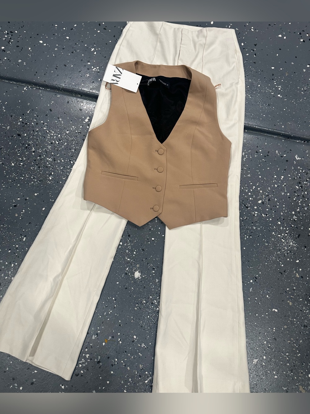 Zara Tan Buttoned Vest with Cream Trousers